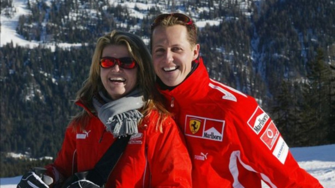 Legenda F1, Michael Schumacher bersama istrinya. 