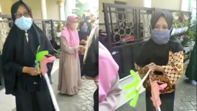 Viral salam unik lebaran dengan kayu (Foto/makassar_iinfo)