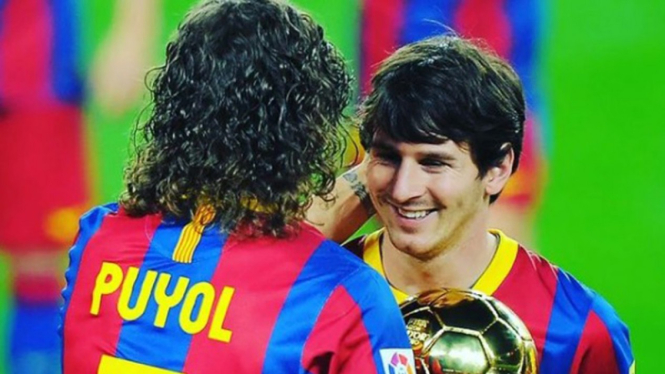 Carles Puyol dan Lionel Messi
