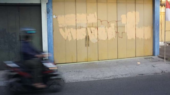 Grafiti bernada sindiran di Solo yang telah dihapus