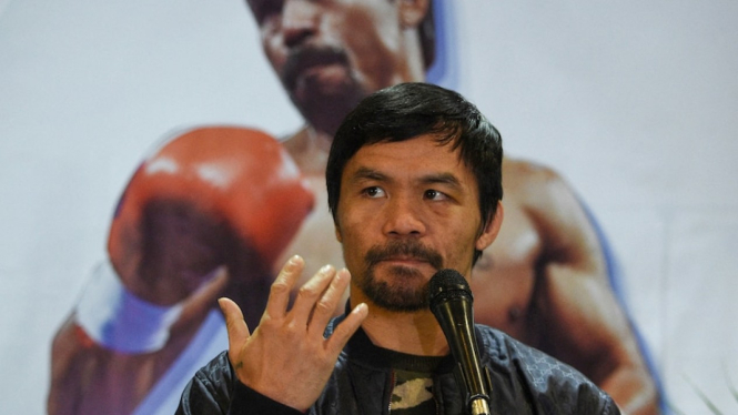 Ikon tinju Manny Pacquiao berencana mencalonkan diri sebagai presiden Filipina pada 2022. (AFP: Ted Aljibe/File photo)