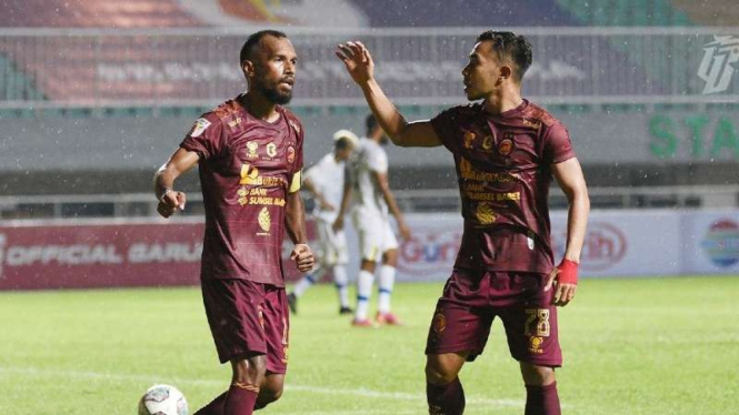 Pemain Sriwijaya FC rayakan gol.