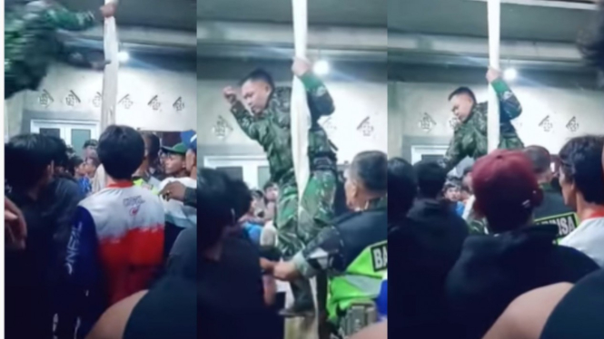 Aksi heroik anggota TNI tiba-tiba muncul dan hinggap di sebuah tiang
