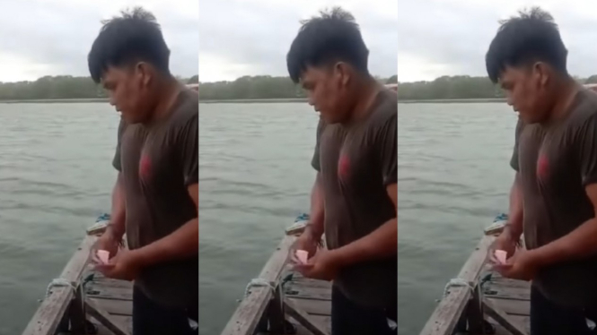 Viral Pria Tebar Uang ke Laut  demi Dapat Ikan