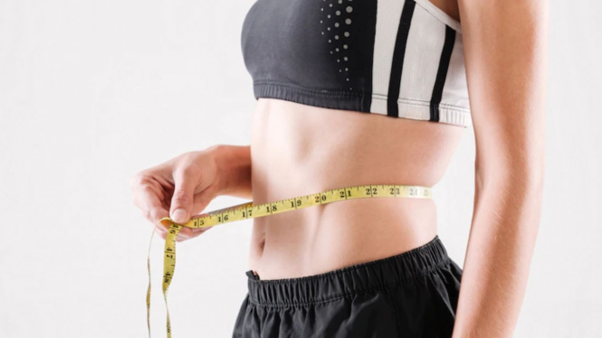 Ilustrasi perut rata dari proses menurunkan berat badan