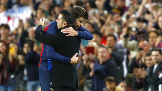 Gerard Pique dan Xavi Hernandez