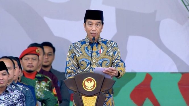 Presiden Jokowi saat apel akbar Pasukan Kokam Pemuda Muhammadiyah di Surakarta