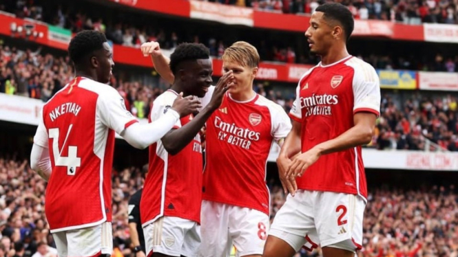 Selebrasi pemain Arsenal usai bobol gawang Tottenham Hotspur