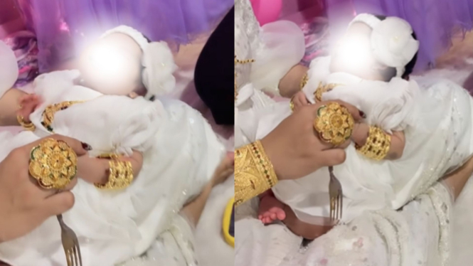 Bayi dipakaikan banyak perhiasan emas