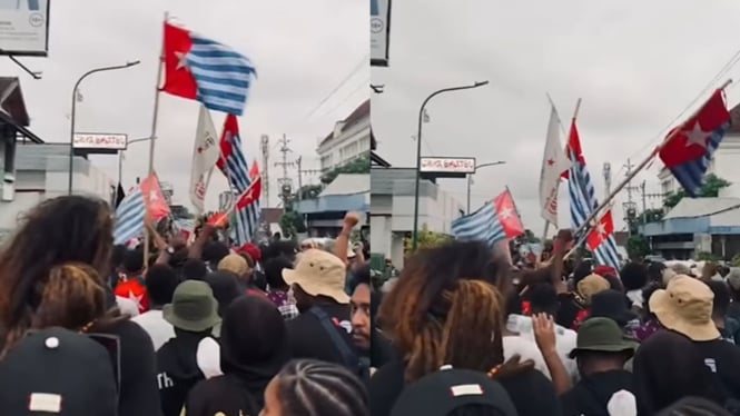 Aliansi Mahasiswa Papua (AMP) mengibarkan bendera Bintang Kejora