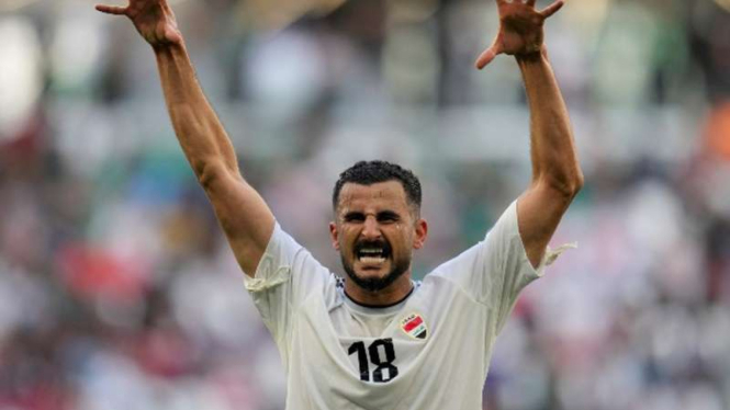 Pemain Timnas Irak, Aymen Hussein rayakan gol ke gawang Jepang