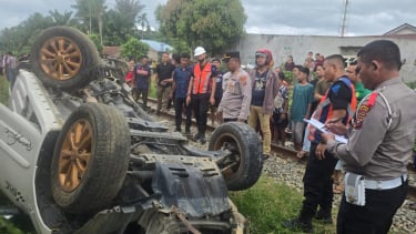 Keputusan Kematian antara Mobil Kereta Api di Kabupaten Asanah.